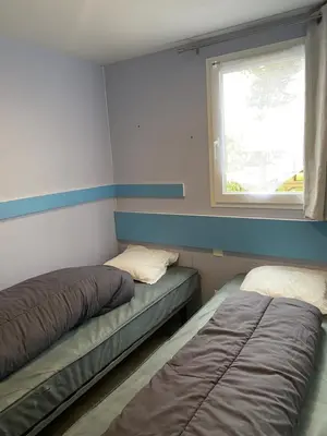 Un ou plusieurs lits dans un hébergement de l'établissement Mobil Home cosy 5 personnes proche du Puy Du Fou
