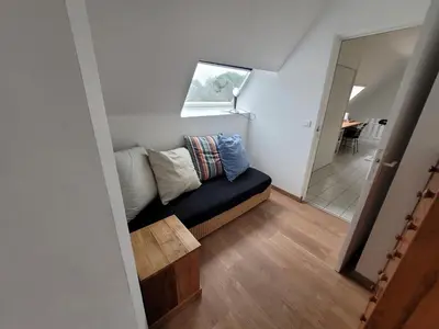Coin salon dans l'établissement Le jardin de lumière -chambre2