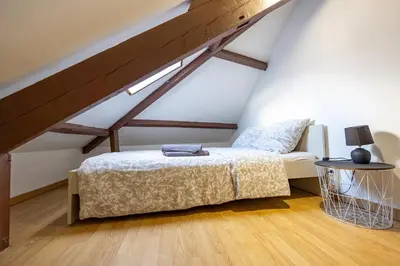 Un ou plusieurs lits dans un hébergement de l'établissement Le petit duplex du Paul B