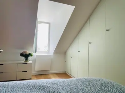Un ou plusieurs lits dans un hébergement de l'établissement Face Mer Villa Le Petit Breton