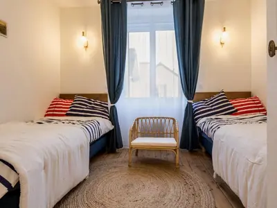 Un ou plusieurs lits dans un hébergement de l'établissement Villa face à la mer avec terrasse privative, confort moderne, Wi-Fi gratuit à Saint-Nazaire - FR-1-306-1260