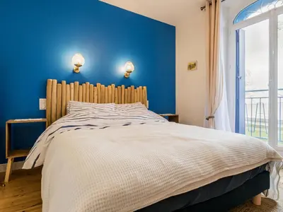 Un ou plusieurs lits dans un hébergement de l'établissement Villa face à la mer avec terrasse privative, confort moderne, Wi-Fi gratuit à Saint-Nazaire - FR-1-306-1260