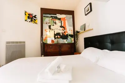 Un ou plusieurs lits dans un hébergement de l'établissement Appartement de l'Eléphant