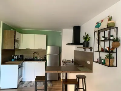 Cuisine ou kitchenette dans l'établissement Charment Appartement Duplex - Pornichet