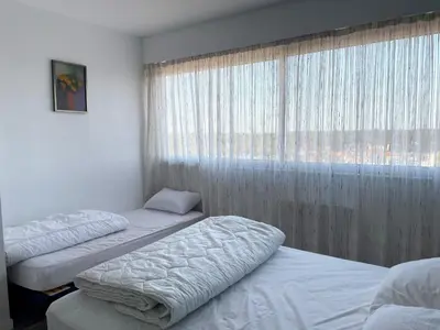 Un ou plusieurs lits dans un hébergement de l'établissement Bel appartement 2 chambres moderne face mer avec garage - FR-1-323-329
