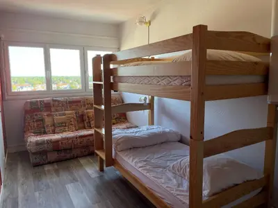 Un ou plusieurs lits dans un hébergement de l'établissement Bel appartement 2 chambres moderne face mer avec garage - FR-1-323-329