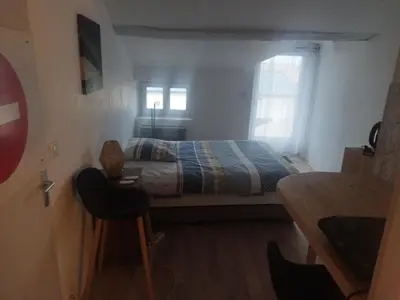 Un ou plusieurs lits dans un hébergement de l'établissement Studio au coeur de la ferme