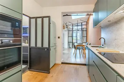Cuisine ou kitchenette dans l'établissement L'élégance - Wifi - Climatisé - Vintage