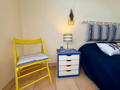 Un ou plusieurs lits dans un hébergement de l'établissement Maison spacieuse avec jardin, proche forêt et plage, 3 chambres, équipements de loisirs, parking privé - FR-1-323-435