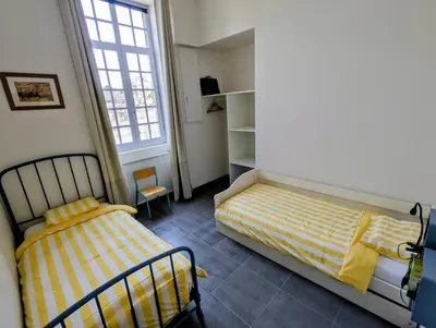 Un ou plusieurs lits dans un hébergement de l'établissement La Bonne Ecole