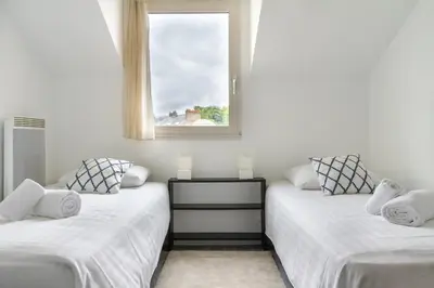 Un ou plusieurs lits dans un hébergement de l'établissement Epicea- Spacieux 3 chambres avec parking.