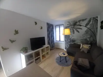 Télévision ou salle de divertissement dans l'établissement Maison de ville