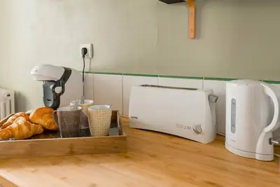 Cuisine ou kitchenette dans l'établissement Le Terminus