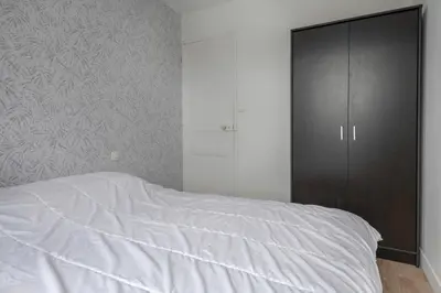 Un ou plusieurs lits dans un hébergement de l'établissement À 50m de la plage, Appartement vue mer