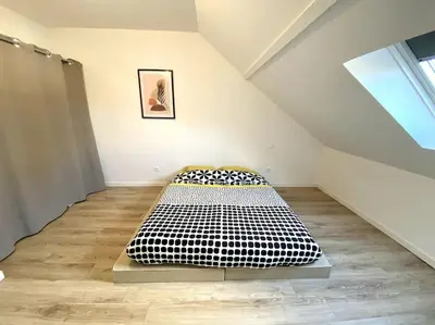 Un ou plusieurs lits dans un hébergement de l'établissement Appartement 2chambres/PuyDuFou