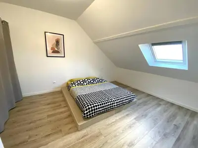 Un ou plusieurs lits dans un hébergement de l'établissement Appartement 2chambres/PuyDuFou