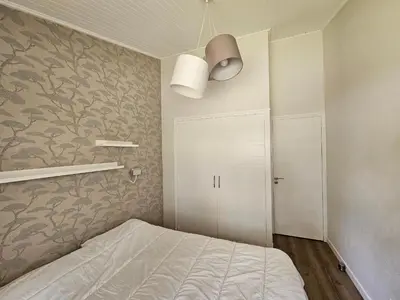 Un ou plusieurs lits dans un hébergement de l'établissement Superbe maison 4 chambres, proche plage, au calme, avec WIFI - FR-1-323-375