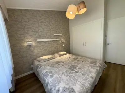 Un ou plusieurs lits dans un hébergement de l'établissement Superbe maison 4 chambres, proche plage, au calme, avec WIFI - FR-1-323-375