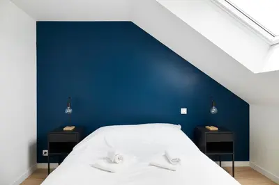 Un ou plusieurs lits dans un hébergement de l'établissement Le Grand Bleu - Wifi fibre/Linge/Accès cour