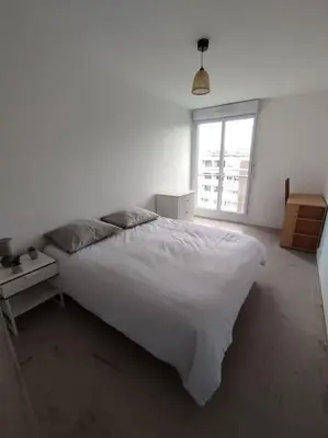 Un ou plusieurs lits dans un hébergement de l'établissement Appartement proche parc expo (4)