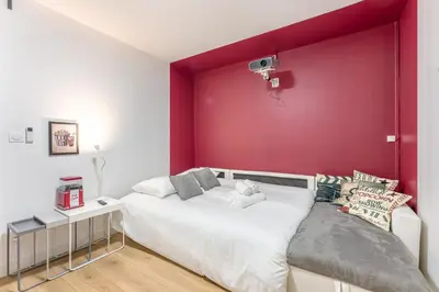 Un ou plusieurs lits dans un hébergement de l'établissement Le Rex - Bel appt avec sauna