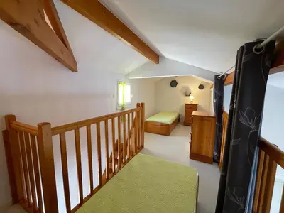 Un ou plusieurs lits dans un hébergement de l'établissement Maison 4-5 pers à Saint Jean de Monts avec piscine, proche plage et forêt - FR-1-323-478