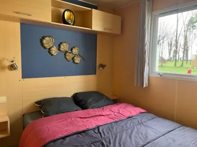 Un ou plusieurs lits dans un hébergement de l'établissement Mobil home 6 personnes - puy du fou