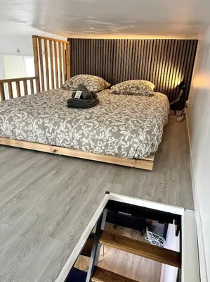 Un ou plusieurs lits dans un hébergement de l'établissement Studio Petit Colombel 2pers Quartier St Felix