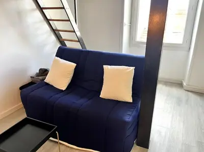 Coin salon dans l'établissement Studio Petit Colombel 2pers Quartier St Felix