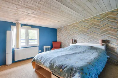 Un ou plusieurs lits dans un hébergement de l'établissement Maison moderne avec jardin pour 12 personnes