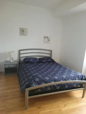 Un ou plusieurs lits dans un hébergement de l'établissement Appartement 2 chambres vue loire