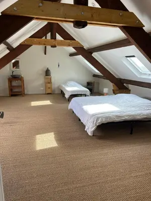 Un ou plusieurs lits dans un hébergement de l'établissement Gîte campagne