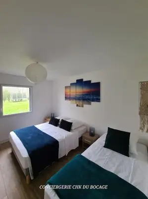 Un ou plusieurs lits dans un hébergement de l'établissement Le Petit Loup grande maison de charme en campagne