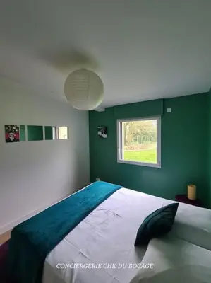 Un ou plusieurs lits dans un hébergement de l'établissement Le Petit Loup grande maison de charme en campagne