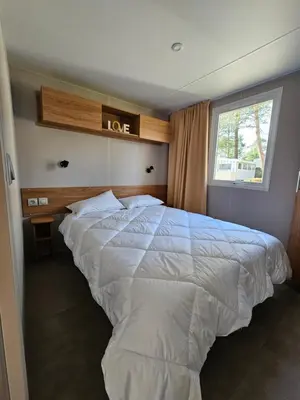 Un ou plusieurs lits dans un hébergement de l'établissement Jolie Mobil home 2 chambres (198)
