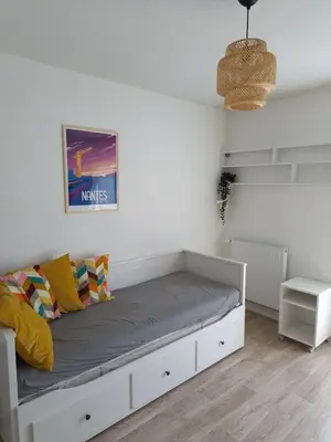 Un ou plusieurs lits dans un hébergement de l'établissement CHROMA - Studio Nantes GARE SUD