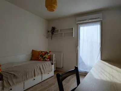 Un ou plusieurs lits dans un hébergement de l'établissement CHROMA - Studio Nantes GARE SUD