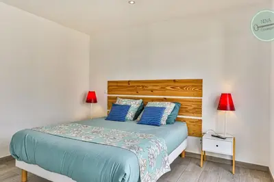 Un ou plusieurs lits dans un hébergement de l'établissement Villa la Fleur des Dunes