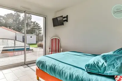 Un ou plusieurs lits dans un hébergement de l'établissement Villa la Fleur des Dunes