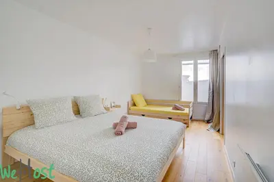 Un ou plusieurs lits dans un hébergement de l'établissement Scribe bleu1 Cosy & calme au cœur de Nantes