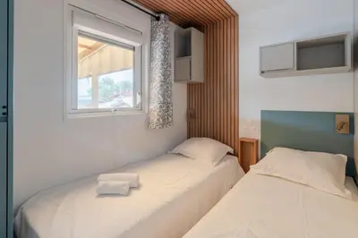 Un ou plusieurs lits dans un hébergement de l'établissement Mobil-home 40m - Piscine - Jardin