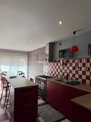 Cuisine ou kitchenette dans l'établissement GITES au calme