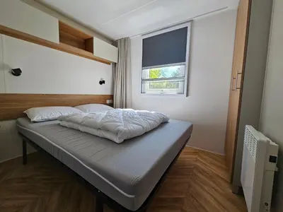 Un ou plusieurs lits dans un hébergement de l'établissement Mobil home 3 chambres (413)