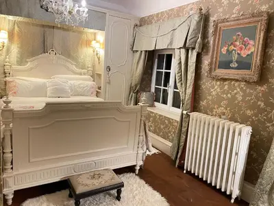 Un ou plusieurs lits dans un hébergement de l'établissement Chambre de charme dans un jardin de 1500m2