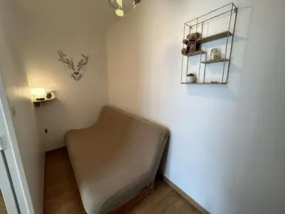 Coin salon dans l'établissement Appartement 2 pièces, 5 couchages, parking privé, proche plage et commerces, Saint-Hilaire-de-Riez - FR-1-224C-287