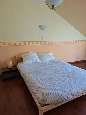 Un ou plusieurs lits dans un hébergement de l'établissement Gite 3 chambres - proche canal - bretagne