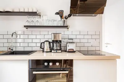 Cuisine ou kitchenette dans l'établissement Le Aristide - Centre Ville - Calme - Terrasse