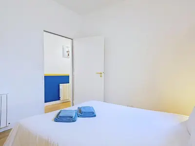 Un ou plusieurs lits dans un hébergement de l'établissement Appartement Le Porto