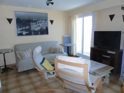 Télévision ou salle de divertissement dans l'établissement Le Grand Cap