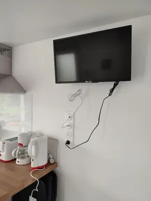 Télévision ou salle de divertissement dans l'établissement Maison de bourg équipée à 20mn du Puy du Fou - 4 pers